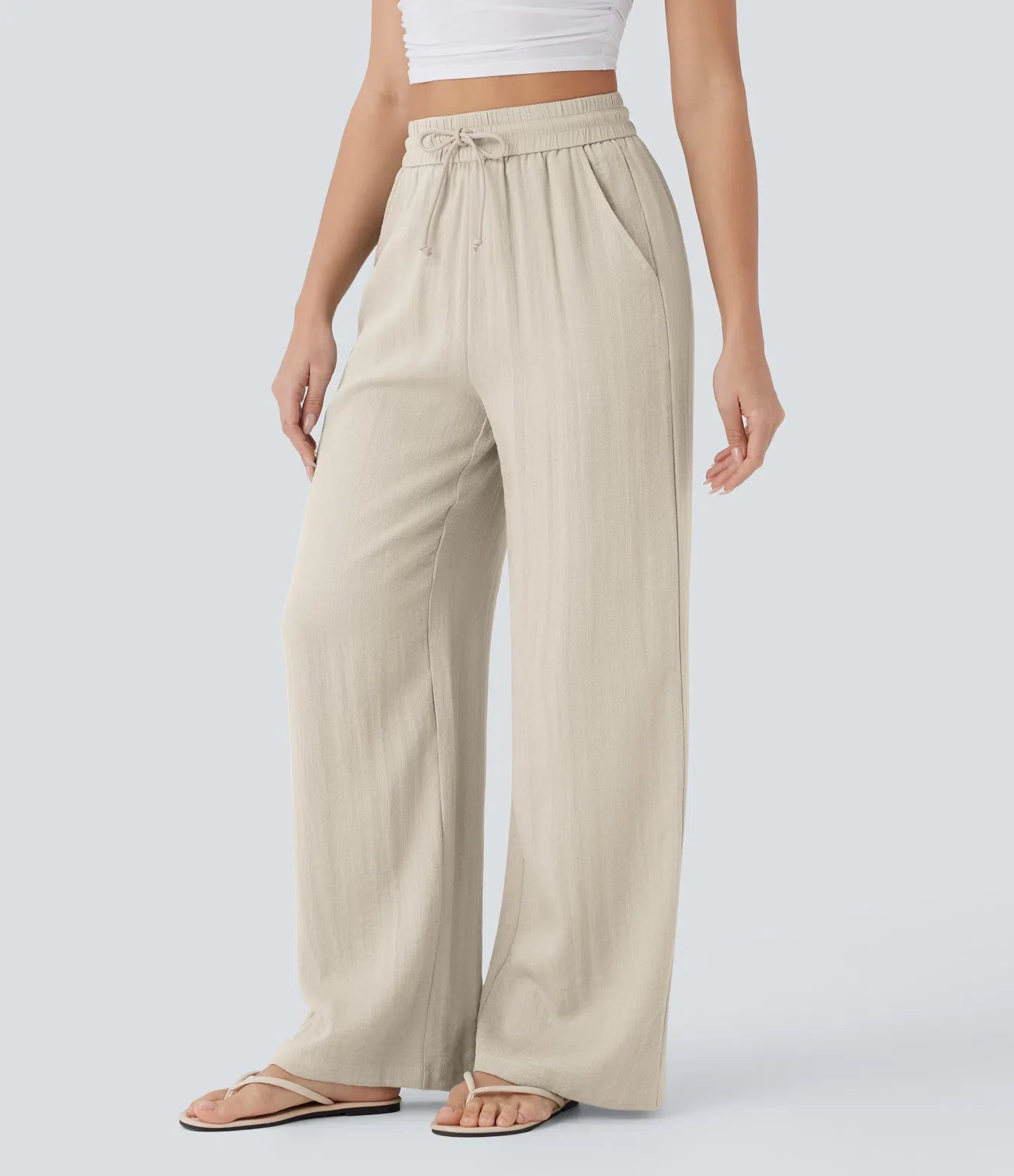 Pantalon fluide taille haute coupe large, effet lin premium avec cordon ajustable et poches discrètes